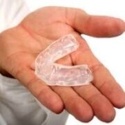 mouthguard for cutting teeth, symptom of the presence of parasites