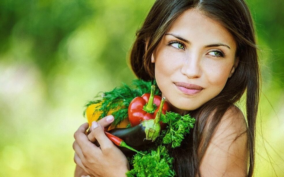 girl holding vegetables to cleanse the body from parasites